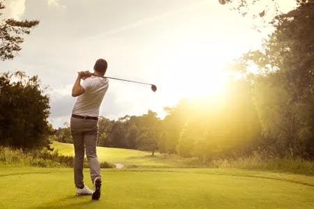 man golfing