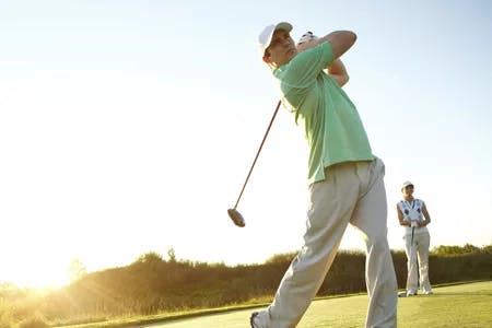 front view of man golfing